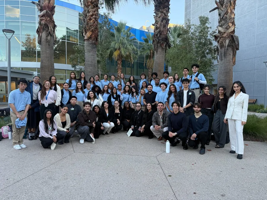COPE Health Scholars community group gathered outside a clinical learning site