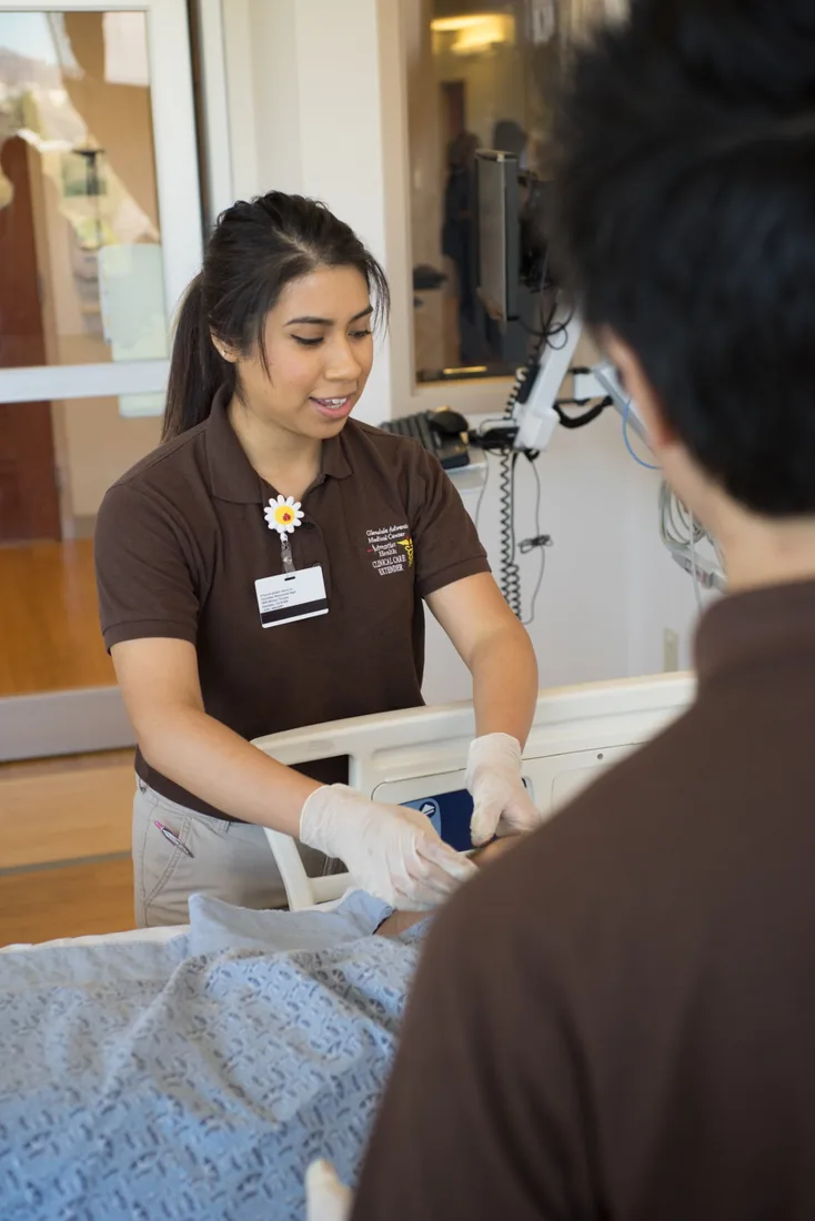 Health Scholar providing patient support in a clinical setting
